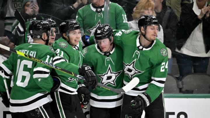 Feb 14, 2023; Dallas, Texas, USA; Dallas Stars left wing Jason Robertson (21) and defenseman Ryan Suter (20) and defenseman Nils Lundkvist (5) and center Roope Hintz (24) and center Joe Pavelski (16) celebrate a goal scored by Robertson against the Boston Bruins during the second period at the American Airlines Center. Mandatory Credit: Jerome Miron-USA TODAY Sports