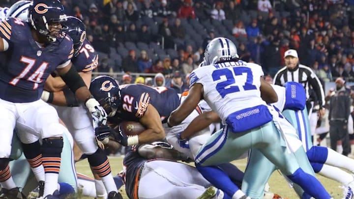 Dec 4, 2014; Chicago, IL, USA; Chicago Bears running back Matt Forte (22) scores a touchdown with Dallas Cowboys free safety J.J. Wilcox (27) defending during the second half at Soldier Field. Dallas won 41-28. Mandatory Credit: Dennis Wierzbicki-USA TODAY Sports