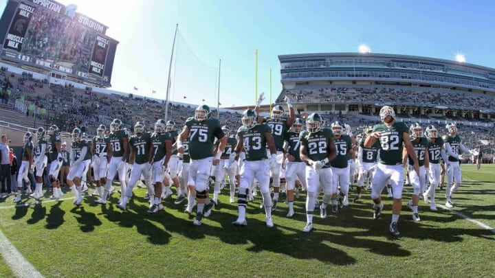 Oct 8, 2016; East Lansing, MI, USA; Michigan State Spartans take the field prior to a game against the Brigham Young Cougars at Spartan Stadium. Mandatory Credit: Mike Carter-USA TODAY Sports