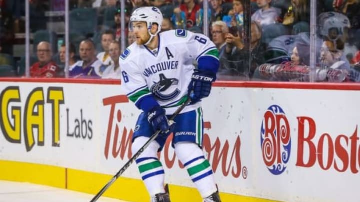 Sep 25, 2015; Calgary, Alberta, CAN; Vancouver Canucks defenseman Yannick Weber (6) controls the puck against the Calgary Flames during the first period at Scotiabank Saddledome. Mandatory Credit: Sergei Belski-USA TODAY Sports