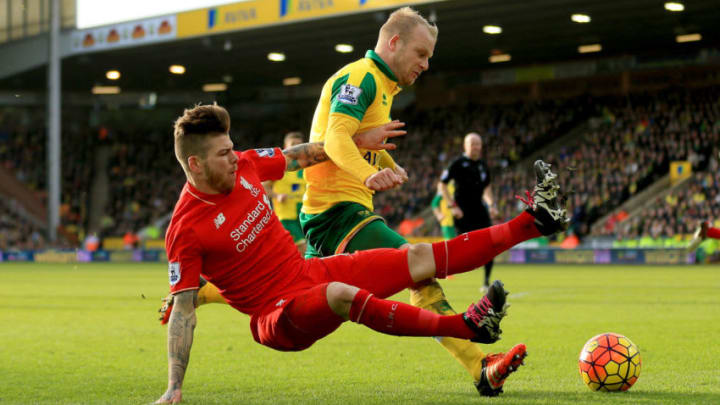 NORWICH, ENGLAND - JANUARY 23: Steven Naismith of Norwich City is fouled by Alberto Moreno of Liverpool resulting in the penalty kick during the Barclays Premier League match between Norwich City and Liverpool at Carrow Road on January 23, 2016 in Norwich, England. (Photo by Stephen Pond/Getty Images)