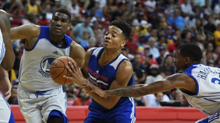 LAS VEGAS, NV - JULY 08: Markelle Fultz #7 of the Philadelphia 76ers drives against Kevon Looney #5 and Alex Hamilton #33 of the Golden State Warriors during the 2017 Summer League at the Thomas & Mack Center on July 8, 2017 in Las Vegas, Nevada. NOTE TO USER: User expressly acknowledges and agrees that, by downloading and or using this photograph, User is consenting to the terms and conditions of the Getty Images License Agreement. (Photo by Ethan Miller/Getty Images)
