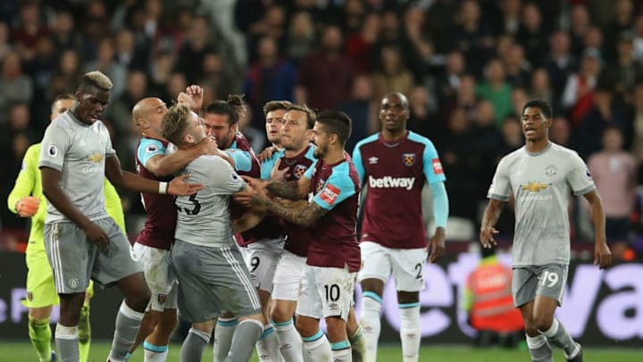 LONDON, ENGLAND - MAY 10: Luke Shaw of Manchester United fight with Andy Carroll of West Ham United during the Premier League match between West Ham United and Manchester United at London Stadium on May 10, 2018 in London, England. (Photo by Steve Bardens/Getty Images)