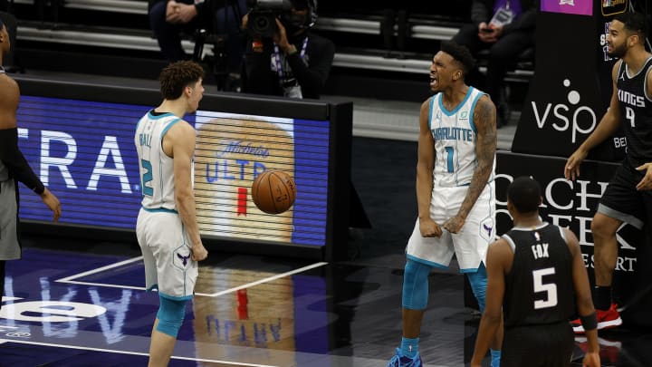 SACRAMENTO, CALIFORNIA – FEBRUARY 28: Malik Monk #1 celebrates with LaMelo Ball #2 of the Charlotte Hornets after Monk made a basket with one second left to tie their game against the Sacramento Kings at Golden 1 Center on February 28, 2021, in Sacramento, California. Monk was fouled on the play and made the free throw for the winning point. NOTE TO USER: User expressly acknowledges and agrees that, by downloading and or using this photograph, User is consenting to the terms and conditions of the Getty Images License Agreement. (Photo by Ezra Shaw/Getty Images)