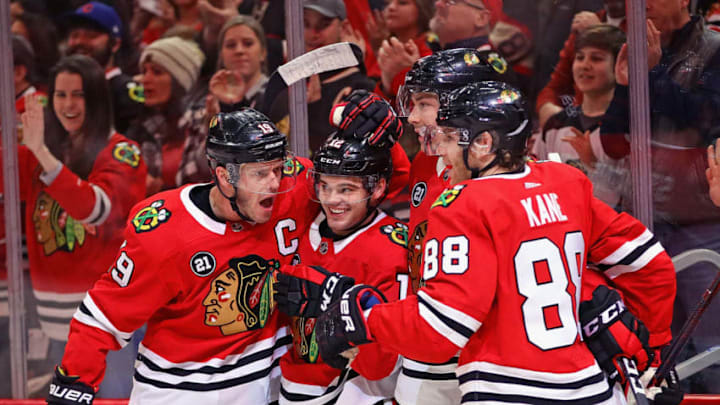 Fantasy Hockey: CHICAGO, ILLINOIS - DECEMBER 23: (L-R) Jonathan Toews #19, Alex DeBrincat #12 Dylan Stome #17 and Patrick Kane #88 of the Chicago Blackhawks celebrate DeBrincat's second period goal against the Florida Panthers at the United Center on December 23, 2018 in Chicago, Illinois. (Photo by Jonathan Daniel/Getty Images)