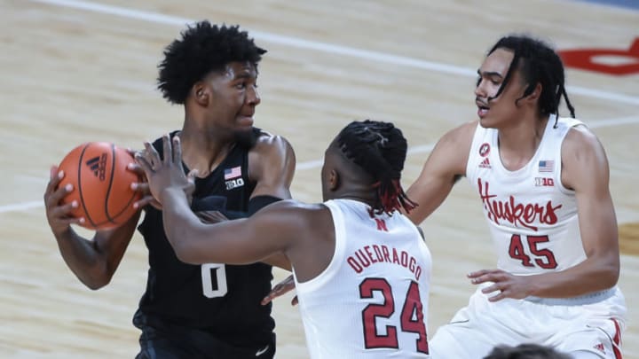 Jan 2, 2021; Lincoln, Nebraska, USA; Michigan State Spartans forward Aaron Henry (0) looks to pass against Nebraska Cornhuskers forward Yvan Ouedraogo (24) and guard Dalano Banton (45) in the first half at Pinnacle Bank Arena. Mandatory Credit: Steven Branscombe-USA TODAY Sports