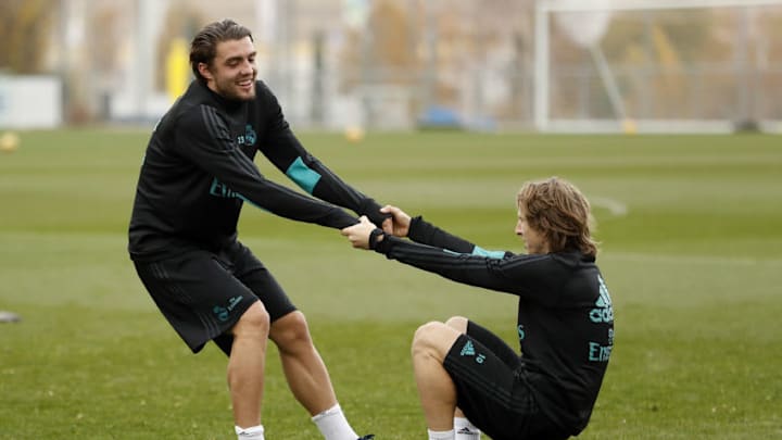MADRID, SPAIN - NOVEMBER 24: Mateo Kovacic (L) of Real Madrid helps up Luka Modric during a training session at Valdebebas training ground on November 24, 2017 in Madrid, Spain. (Photo by Angel Martinez/Real Madrid via Getty Images)