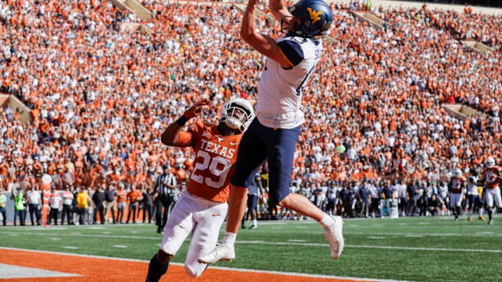 AUSTIN, TX - NOVEMBER 03: David Sills V #13 of the West Virginia Mountaineers catches a pass for a touchdown defended by Josh Thompson #29 of the Texas Longhorns in the second quarter at Darrell K Royal-Texas Memorial Stadium on November 3, 2018 in Austin, Texas. (Photo by Tim Warner/Getty Images)