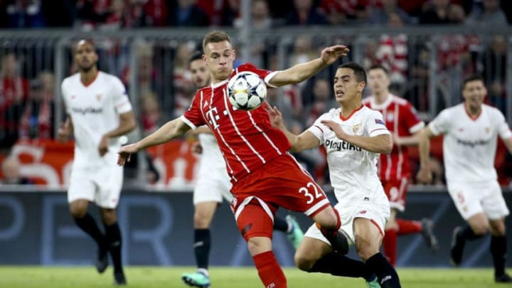 MUNICH, GERMANY - APRIL 11: Joshua Kimmich of Bayern Munich, Wissam Ben Yedder of FC Sevilla during the UEFA Champions League Quarter Final second leg match between Bayern Muenchen and FC Sevilla at Allianz Arena on April 11, 2018 in Munich, Germany. (Photo by Jean Catuffe/Getty Images)