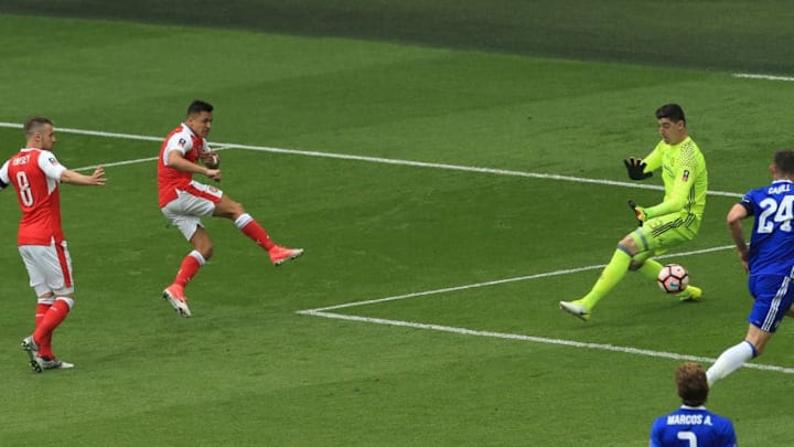 LONDON, ENGLAND - MAY 27: Alexis Sanchez of Arsenal scores his sides first goal past Thibaut Courtois of Chelsea during the Emirates FA Cup Final between Arsenal and Chelsea at Wembley Stadium on May 27, 2017 in London, England. (Photo by Stephen Pond - The FA/The FA via Getty Images)