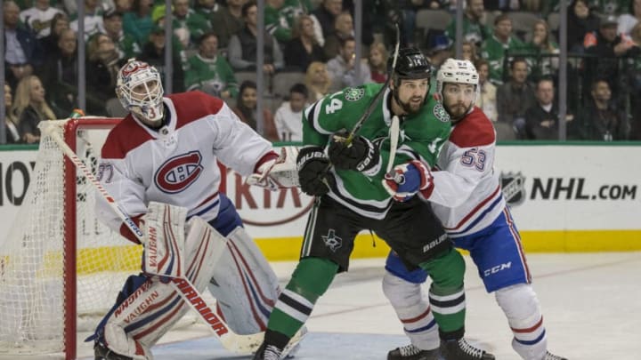 DALLAS, TX - DECEMBER 31: Dallas Stars left wing Jamie Benn (14) and Montreal Canadiens defenseman Victor Mete (53) battle in front of Montreal Canadiens goaltender Antti Niemi (37) during the game between the Dallas Stars and the Montreal Canadiens on December 31, 2018 at the American Airlines Center in Dallas, Texas. (Photo by Matthew Pearce/Icon Sportswire via Getty Images)