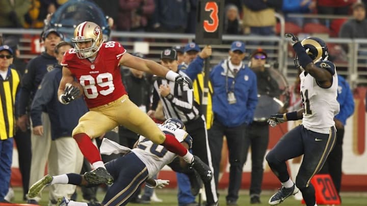 Jan 3, 2016; Santa Clara, CA, USA; San Francisco 49ers tight end Vance McDonald (89) avoids a tackle after making a catch against the St. Louis Rams in the fourth quarter at Levi