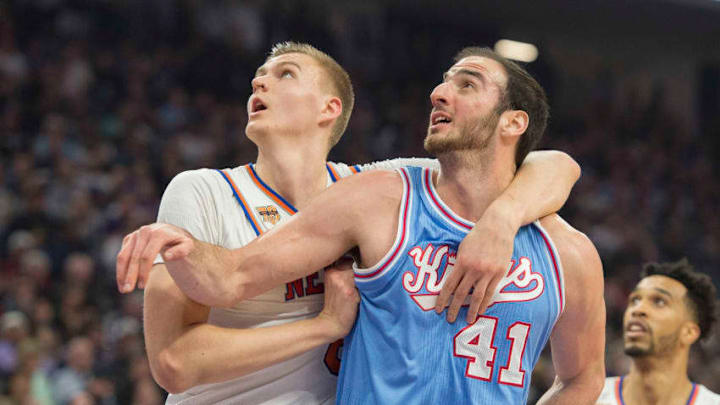 The New York Knicks' Kristaps Porzingis, left, defends the Sacramento Kings' Kosta Koufos (41) at Golden 1 Center in Sacramento, Calif., on Friday, Dec. 9, 2016. (Hector Amezcua/Sacramento Bee/TNS via Getty Images)