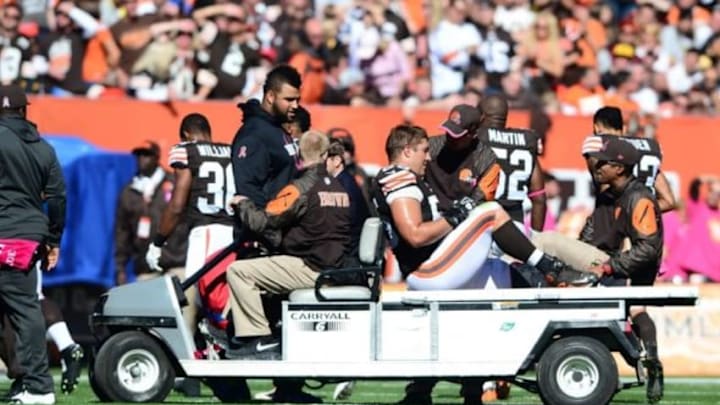Oct 12, 2014; Cleveland, OH, USA; Cleveland Browns center Alex Mack (55) is carted off the field after an injury during the second quarter against the Pittsburgh Steelers at FirstEnergy Stadium. Mandatory Credit: Andrew Weber-USA TODAY Sports