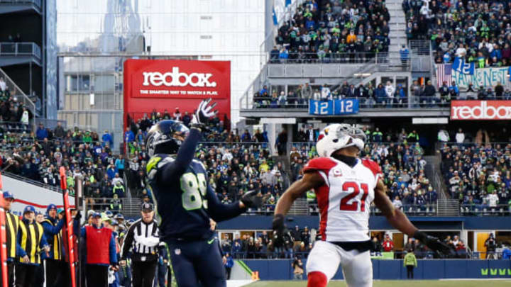 SEATTLE, WA - DECEMBER 31: Wide receiver Doug Baldwin #89 of the Seattle Seahawks brings in a 29 yard pass from Russell Wilson #3 against cornerback Patrick Peterson #21 of the Arizona Cardinals during the fourth quarter of the game at CenturyLink Field on December 31, 2017 in Seattle, Washington. (Photo by Otto Greule Jr/Getty Images)