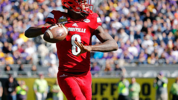 Dec 31, 2016; Orlando , FL, USA; Louisville Cardinals quarterback Lamar Jackson (8) drops back against the LSU Tigers during the first half at Camping World Stadium. Mandatory Credit: Kim Klement-USA TODAY Sports