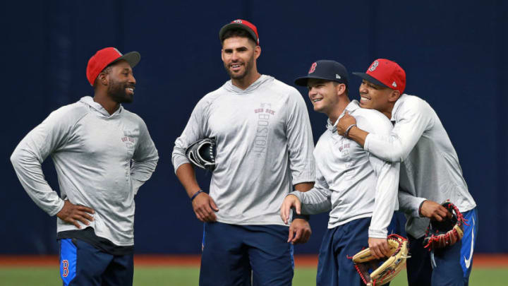 ST. PETERSBURG, FL - MARCH 28: Boston Red Sox outfielders (left to right) Jackie Bradley, Jr. J.D. Martinez, Andrew Benintendi and Mookie Betts have some fun as they get ready for Opening Day. Martinez will be making his Red Sox debut in the game. The Boston Red Sox held a workout session today to get ready for the Opening Day of the 2018 baseball season at Tropicana Field in St. Petersburg, FL on March 28, 2018. (Photo by Jim Davis/The Boston Globe via Getty Images)