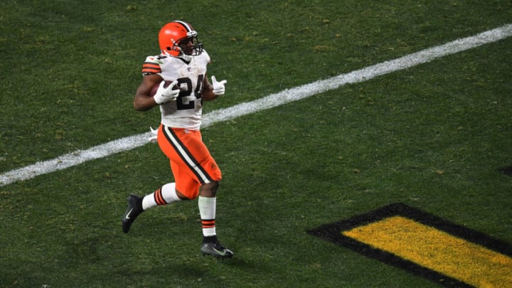 PITTSBURGH, PENNSYLVANIA - JANUARY 10: Nick Chubb #24 of the Cleveland Browns rushes for a touchdown during the second half of the AFC Wild Card Playoff game against the Pittsburgh Steelers at Heinz Field on January 10, 2021 in Pittsburgh, Pennsylvania. (Photo by Joe Sargent/Getty Images)