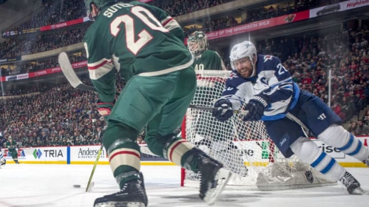 ST. PAUL, MN - JANUARY 13: Ryan Suter #20 of the Minnesota Wild controls the puck with Blake Wheeler #26 of the Winnipeg Jets defending during the game at the Xcel Energy Center on January 13, 2018 in St. Paul, Minnesota. (Photo by Bruce Kluckhohn/NHLI via Getty Images)