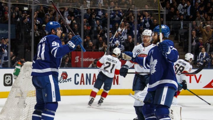 TORONTO, ON - MARCH 25: John Tavares #91 of the Toronto Maple Leafs celebrates his third goal of the night against the Florida Panthers with teammate William Nylander #29 during the second period at the Scotiabank Arena on March 25, 2019 in Toronto, Ontario, Canada. (Photo by Mark Blinch/NHLI via Getty Images)