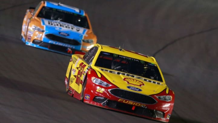 SPARTA, KY - JULY 08: Joey Logano, driver of the #22 Shell Pennzoil/Autotrader Ford, leads Danica Patrick, driver of the #10 Nature's Bakery/Feeding America Ford (Photo by Matt Sullivan/Getty Images)