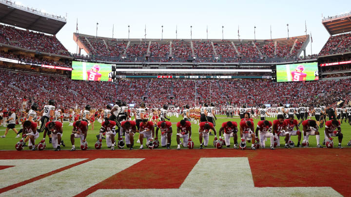 TUSCALOOSA, ALABAMA – SEPTEMBER 24: The Alabama Crimson Tide kneel on the end zone line prior to the game against the Vanderbilt Commodores at Bryant-Denny Stadium on September 24, 2022 in Tuscaloosa, Alabama. (Photo by Kevin C. Cox/Getty Images)