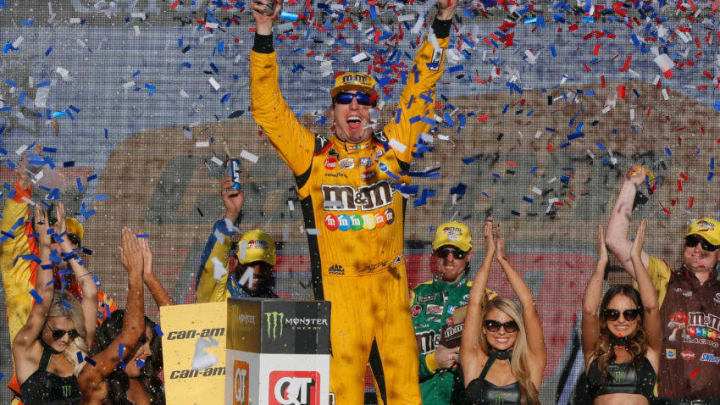 PHOENIX, AZ - NOVEMBER 11: Kyle Busch, driver of the #18 M&M's Toyota, celebrates in Victory Lane after winning the Monster Energy NASCAR Cup Series Can-Am 500 at ISM Raceway on November 11, 2018 in Phoenix, Arizona. (Photo by Jonathan Ferrey/Getty Images)