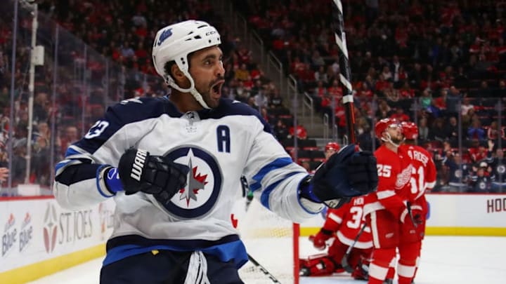 DETROIT, MI - OCTOBER 26: Dustin Byfuglien #33 of the Winnipeg Jets celebrates his third period goal while paying the Detroit Red Wings at Little Caesars Arena on October 26, 2018 in Detroit, Michigan. Winnipeg won the game 2-1.(Photo by Gregory Shamus/Getty Images)