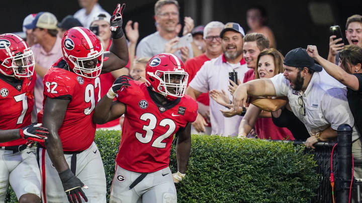 Oct 10, 2020; Athens, Georgia, USA; Georgia Bulldogs linebacker Monty Rice (32) reacts with fans and teammates after causing a fumble and returning it for a touchdown against the Tennessee Volunteers during the second half at Sanford Stadium. Mandatory Credit: Dale Zanine-USA TODAY Sports