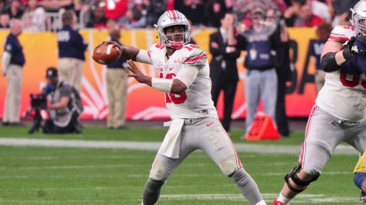 Jan 1, 2016; Glendale, AZ, USA; Ohio State Buckeyes quarterback J.T. Barrett (16) looks to throw during the second half against the Notre Dame Fighting Irish in the 2016 Fiesta Bowl at University of Phoenix Stadium. Mandatory Credit: Matt Kartozian-USA TODAY Sports