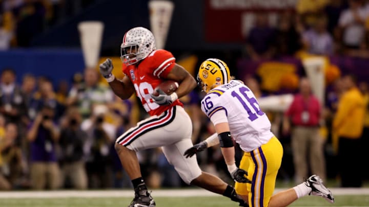 NEW ORLEANS - JANUARY 07: Chris Wells #28 of the Ohio State Buckeyes runs for a 65-yard touchdown in the first quarter against Craig Steltz #16 of the Louisiana State University Tigers during the AllState BCS National Championship on January 7, 2008 at the Louisiana Superdome in New Orleans, Louisiana. (Photo by Andy Lyons/Getty Images) NEW ORLEANS - JANUARY 07: Chris Wells #28 of the Ohio State Buckeyes runs for a 65-yard touchdown in the first quarter against Craig Steltz #16 of the Louisiana State University Tigers during the AllState BCS National Championship on January 7, 2008 at the Louisiana Superdome in New Orleans, Louisiana. (Photo by Andy Lyons/Getty Images)