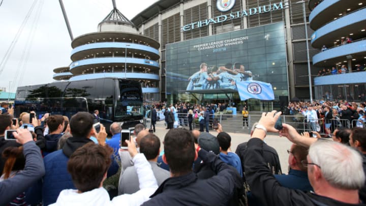 MANCHESTER, ENGLAND - AUGUST 19: Man City fans watch the team arrive during the Premier League match between Manchester City and Huddersfield Town at Etihad Stadium on August 19, 2018 in Manchester, United Kingdom. (Photo by Alex Livesey/Getty Images)
