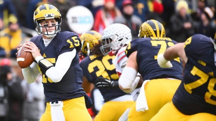 Nov 28, 2015; Ann Arbor, MI, USA; Michigan Wolverines quarterback Jake Rudock (15) drops back to pass during the game against the Ohio State Buckeyes at Michigan Stadium. Mandatory Credit: Tim Fuller-USA TODAY Sports