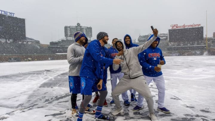 Kris Bryant, Carl Edwards Jr. and their Chicago Cubs teammates pose in the snow on Monday, April 9, 2018 at Wrigley Field in Chicago, Ill. The game was postponed to Tuesday because of the weather. (Brian Cassella/Chicago Tribune/TNS via Getty Images)