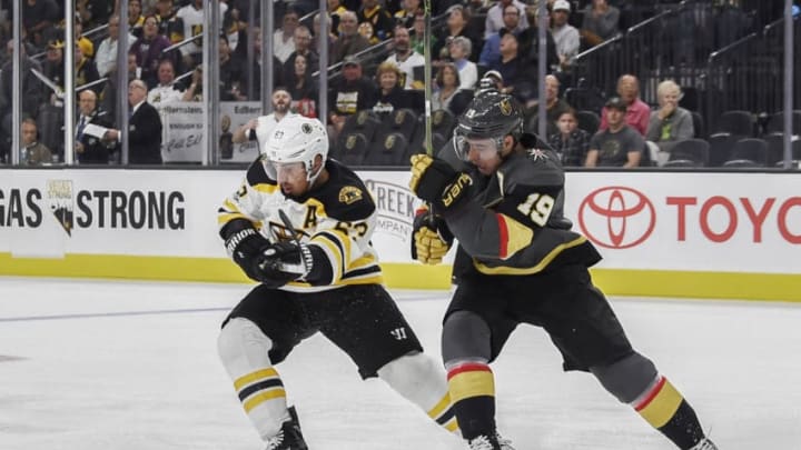 LAS VEGAS, NV - OCTOBER 15: Brad Marchand #63 of the Boston Bruins and Reilly Smith #19 of the Vegas Golden Knights skate to the puck during the game at T-Mobile Arena on October 15, 2017 in Las Vegas, Nevada. (Photo by Todd Lussier/NHLI via Getty Images)