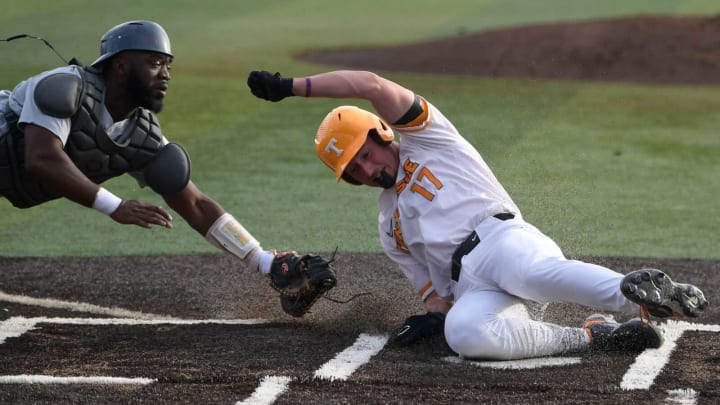 Tennessee’s Jared Dickey (17) is tagged out at home plate by Alabama A&M catcher Jared Tribett (10) during an NCAA college baseball game in Knoxville, Tenn. on Tuesday, February 21, 2023.Ut Baseball Alabama A M