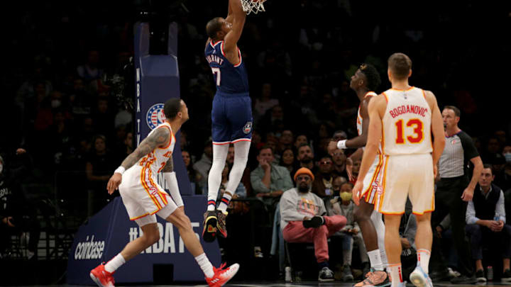 Nov 3, 2021; Brooklyn, New York, USA; Brooklyn Nets forward Kevin Durant (7) dunks against Atlanta Hawks forward John Collins (20) and center Clint Capela (15) and guard Bogdan Bogdanovic (13) during the second quarter at Barclays Center. Mandatory Credit: Brad Penner-USA TODAY Sports