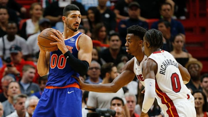 MIAMI, FL - OCTOBER 24: Enes Kanter #00 of the New York Knicks is defended by Hassan Whiteside #21 and Josh Richardson #0 of the Miami Heat during the second half at American Airlines Arena on October 24, 2018 in Miami, Florida. NOTE TO USER: User expressly acknowledges and agrees that, by downloading and or using this photograph, User is consenting to the terms and conditions of the Getty Images License Agreement. (Photo by Michael Reaves/Getty Images)