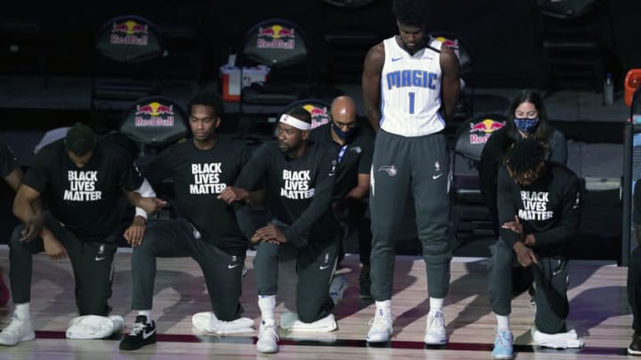Orlando Magic forward Jonathan Isaac elected to stand during the national anthem, making a statement that stood out around everyone else. (Photo by Ashley Landis - Pool/Getty Images)