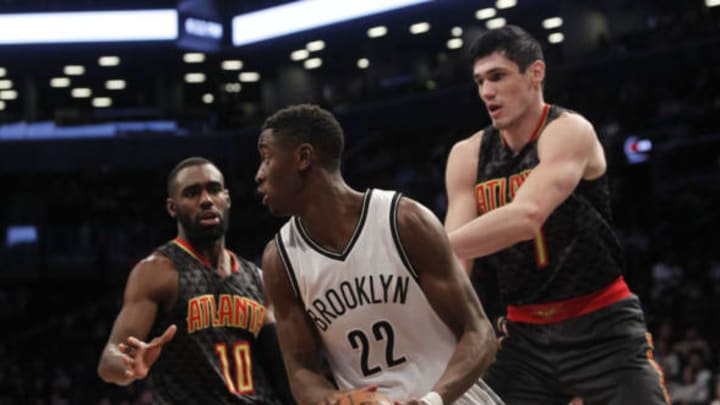 Apr 2, 2017; Brooklyn, NY, USA; Brooklyn Nets guard Caris LeVert (22) looks to pass the ball against Atlanta Hawks guard Tim Hardaway Jr. (10) and forward Ersan Ilyasova (7) at Barclays Center. Mandatory Credit: Nicole Sweet-USA TODAY Sports