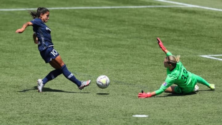 HERRIMAN, UTAH – JULY 17: Britt Eckerstrom #33 of Portland Thorns FC makes a save against Debinha #10 of North Carolina Courage during the second half in the quarterfinal match of the NWSL Challenge Cup at Zions Bank Stadium on July 17, 2020 in Herriman, Utah. (Photo by Maddie Meyer/Getty Images)