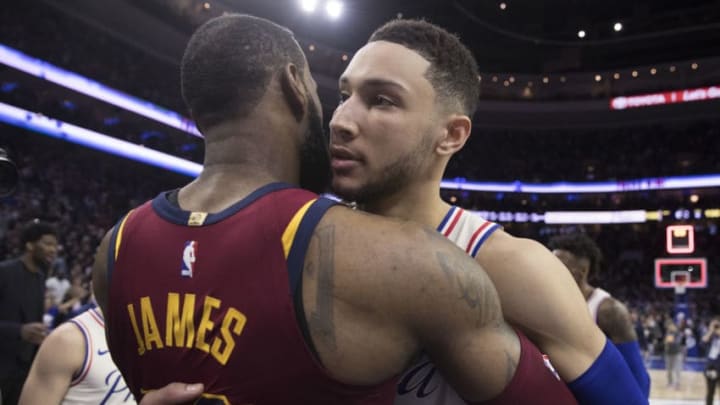 PHILADELPHIA, PA - APRIL 6: LeBron James #23 of the Cleveland Cavaliers hugs Ben Simmons #25 of the Philadelphia 76ers after the game at the Wells Fargo Center on April 6, 2018 in Philadelphia, Pennsylvania. The 76ers defeated the Cavaliers 132-130. NOTE TO USER: User expressly acknowledges and agrees that, by downloading and or using this photograph, User is consenting to the terms and conditions of the Getty Images License Agreement. (Photo by Mitchell Leff/Getty Images)