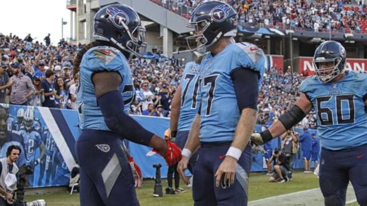 NASHVILLE, TENNESSEE – OCTOBER 20: Derrick Henry #22 of the Tennessee Titans is congratulated by teammate Ryan Tannehill #17 after scoring a touchdown against the Los Angeles Chargers during the second half at Nissan Stadium on October 20, 2019 in Nashville, Tennessee. (Photo by Frederick Breedon/Getty Images)