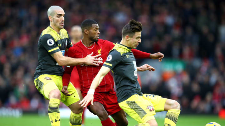 LIVERPOOL, ENGLAND - FEBRUARY 01: Georginio Wijnaldum of Liverpool is challenged by Oriol Romeu and Jan Bednarek of Southampton during the Premier League match between Liverpool FC and Southampton FC at Anfield on February 01, 2020 in Liverpool, United Kingdom. (Photo by Julian Finney/Getty Images)