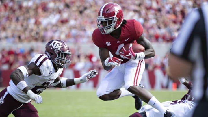 TUSCALOOSA, AL - SEPTEMBER 22: Jerry Judy #4 of the Alabama Crimson Tide jumps over a defender during the second quarter of a game against the Texas A&M Aggies at Bryant-Denny Stadium on September 22, 2018 in Tuscaloosa, Alabama. (Photo by Wesley Hitt/Getty Images)
