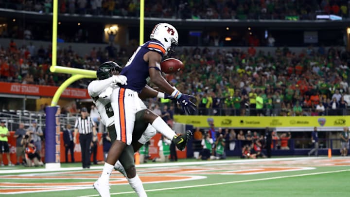 ARLINGTON, TEXAS - AUGUST 31: Seth Williams #18 of the Auburn Tigers makes the game winning touchdown pass against Verone McKinley III #23 of the Oregon Ducks in the fourth quarter during the Advocare Classic at AT&T Stadium on August 31, 2019 in Arlington, Texas. (Photo by Ronald Martinez/Getty Images)