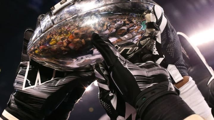 Dec 5, 2015; Indianapolis, IN, USA; The Michigan State Spartans hoist the championship trophy after defeating the Iowa Hawkeyes in the Big Ten Conference football championship game at Lucas Oil Stadium. Mandatory Credit: Aaron Doster-USA TODAY Sports