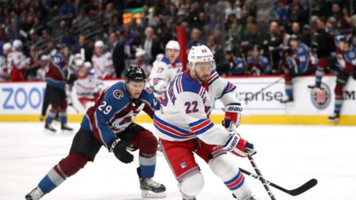 DENVER, COLORADO – JANUARY 04: Kevin Shattenkirk #22 of the New York Rangers advances the puck against Nathan MacKinnon #29 of the Colorado Avalanche at the Pepsi Center on January 04, 2019 in Denver, Colorado. (Photo by Matthew Stockman/Getty Images)
