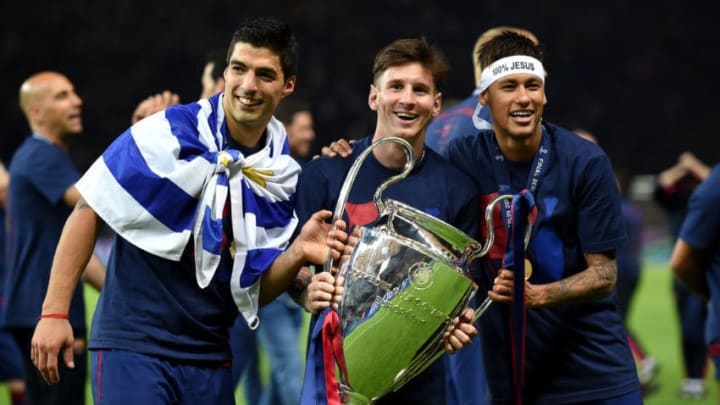 BERLIN, GERMANY - JUNE 06: (L-R) Luis Suarez, Lionel Messi and Neymar of Barcelona celebrate with the trophy after the UEFA Champions League Final between Juventus and FC Barcelona at Olympiastadion on June 6, 2015 in Berlin, Germany. (Photo by Matthias Hangst/Getty Images)
