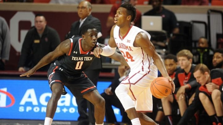 Jan 26, 2016; Norman, OK, USA; Oklahoma Sooners guard Buddy Hield (24) drives to the basket against Texas Tech Red Raiders guard Devaugntah Williams (0) during the first half at Lloyd Noble Center. Mandatory Credit: Mark D. Smith-USA TODAY Sports